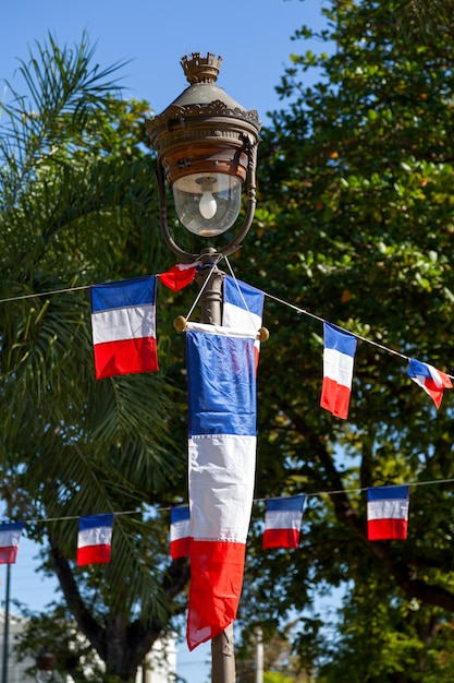 Bunting French flags at a town square for Bastille day