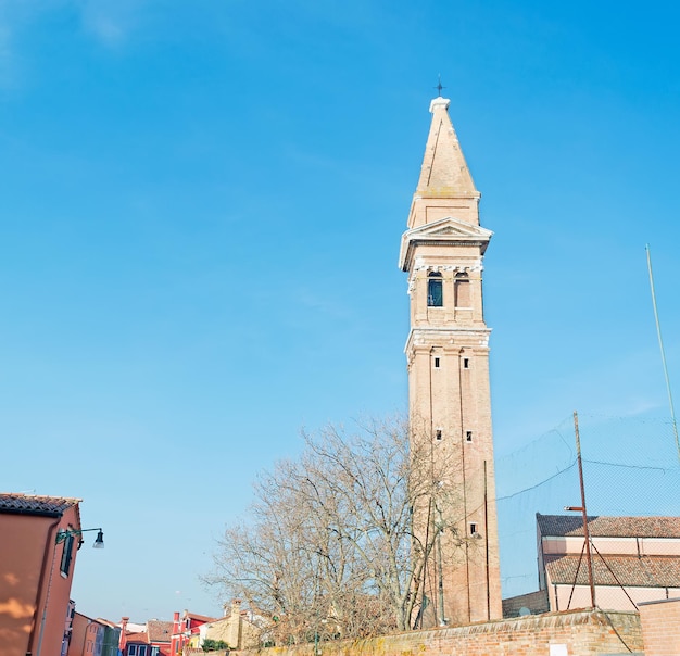 Burano bell tower under a blue sky