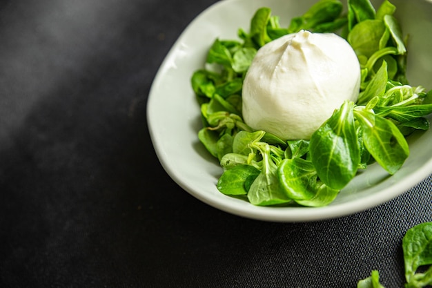 buratta salad green leaves mix fresh healthy meal food snack diet on the table copy space food