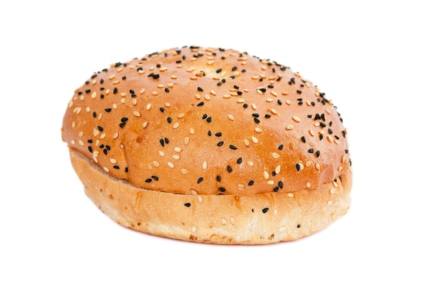 Photo burger bun with sesame seeds on white background