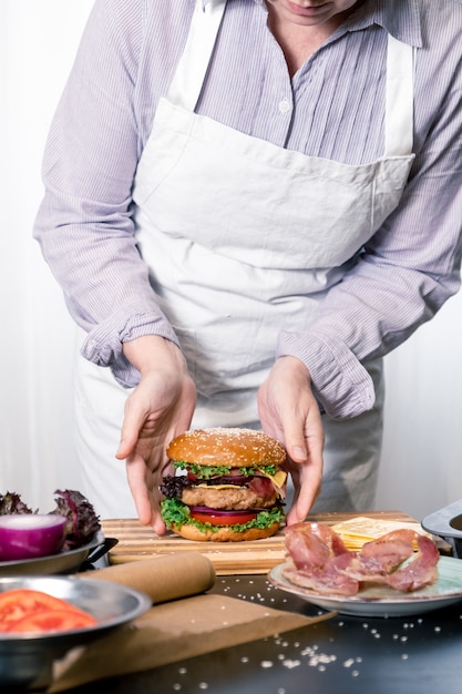 Burger cheeseburger hamburger big chif cook cooking white background home