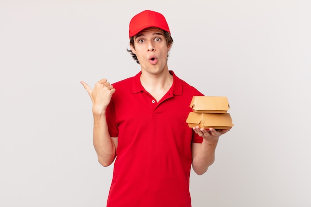 Burger deliver man looking astonished in disbelief