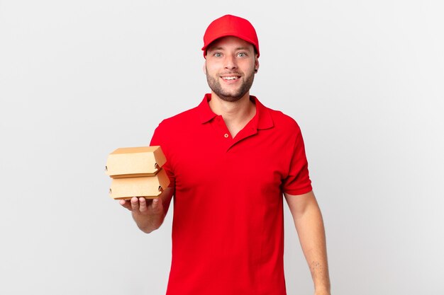 Burger deliver man looking happy and pleasantly surprised