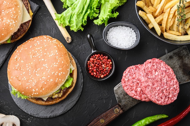 Photo burger and the fresh ingredients on black background, flat lay.