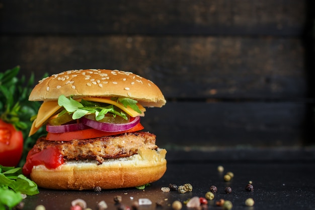 Burger, meat cutlet beef steak, tomato, sauce and lettuce