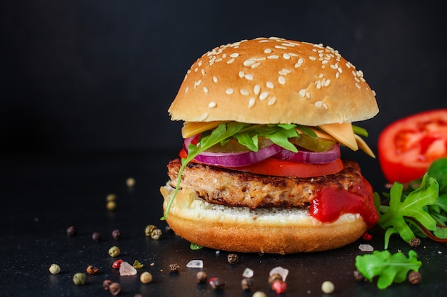 burger, meat cutlet beef steak, tomato, sauce and lettuce