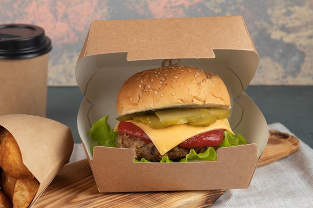 Photo burger in paper box for delivery