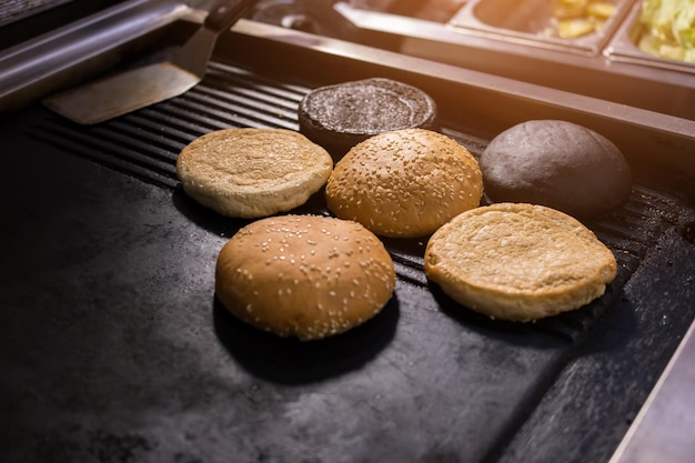 Burger sesame buns baked products on black pan soft and tasty