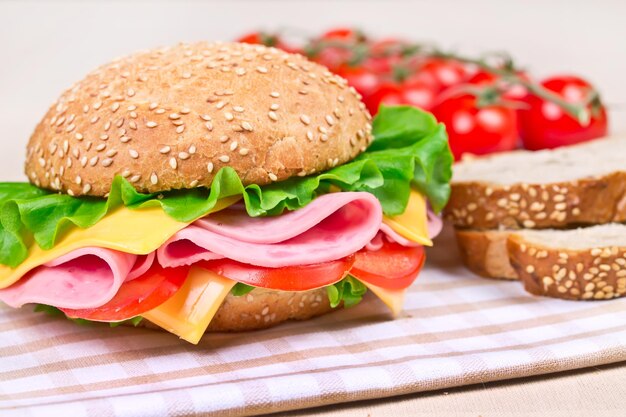 Burger with bacon cheese and cherry tomatoes