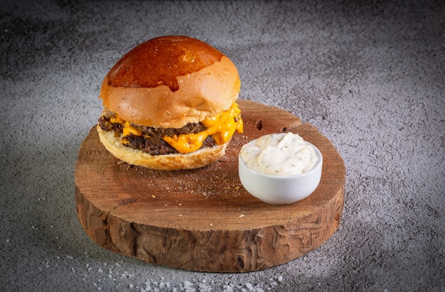 Burger with cheddar cheese and garlic sauce