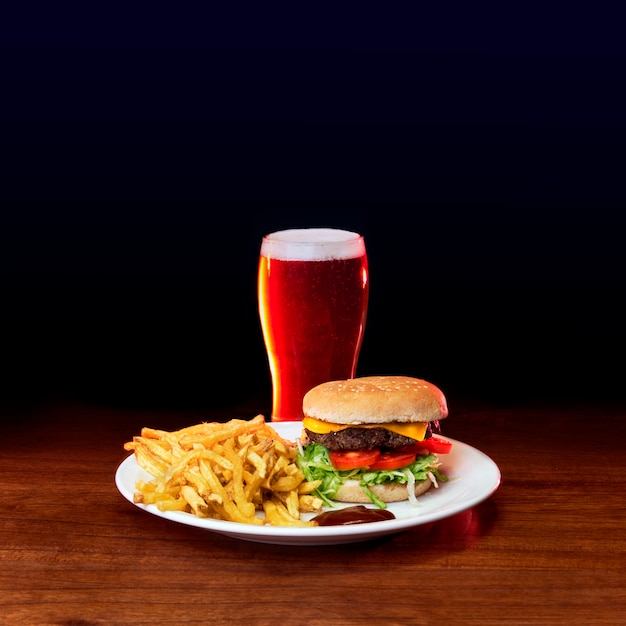 Burger with fries and beer