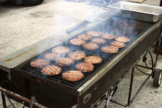 Burgers broiling on a large open grill