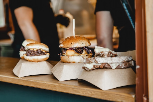 Burgers at a burger feast dinner hamburger food feast party big burger at street food outdoor festiv