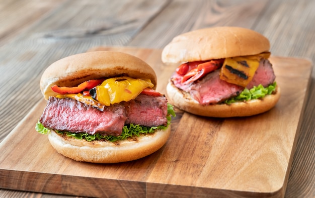 Burgers with grilled steak and bell peppers