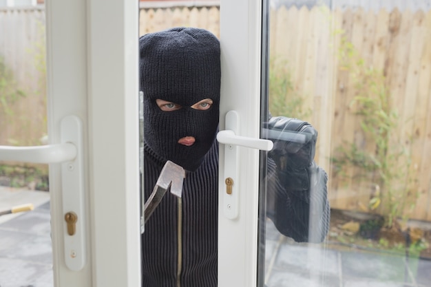 Burglar opening the door