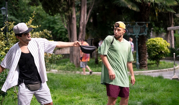 A burglar in the street trying to steal the tourist's bag