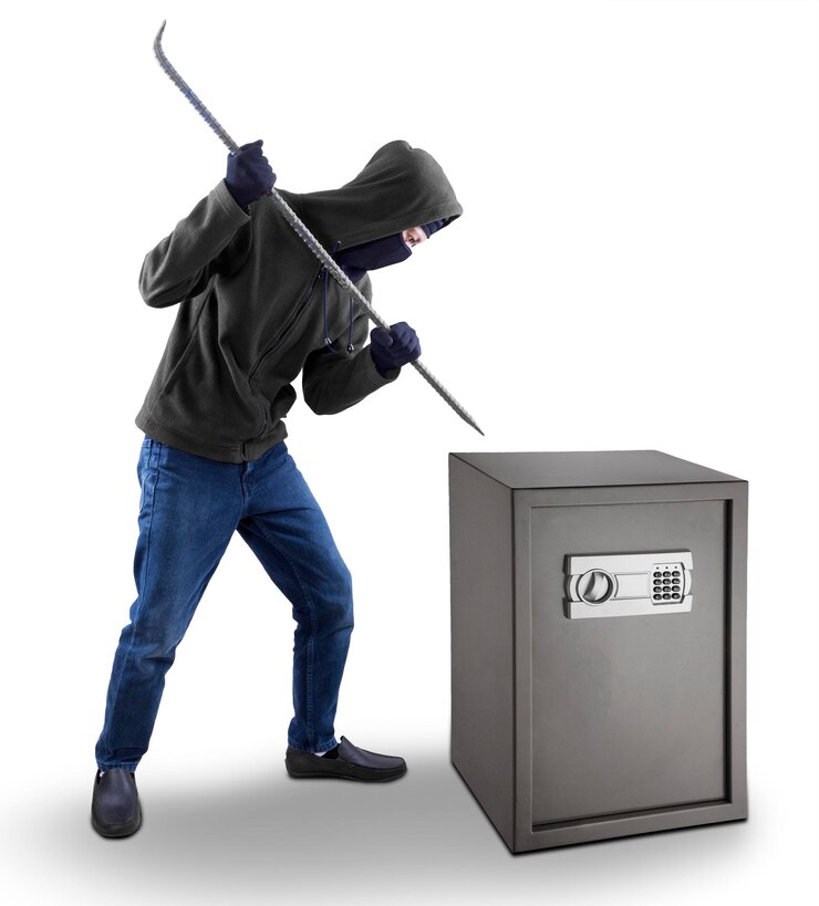 Photo burglar tries to open a safe deposit box