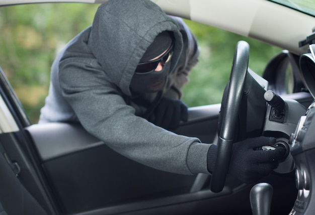 Burglar wearing mask balaclava car burglary