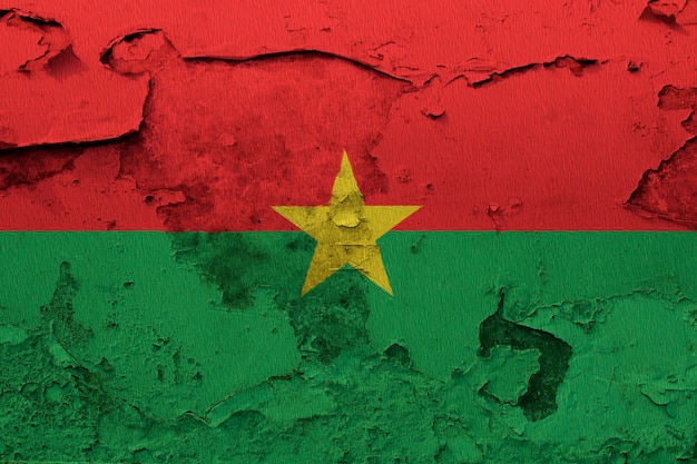 Burkina Faso flag painted on grunge cracked wall