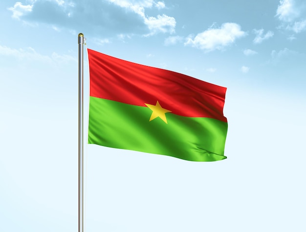 Burkina Faso national flag waving in blue sky with clouds Burkina Faso flag 3D illustration