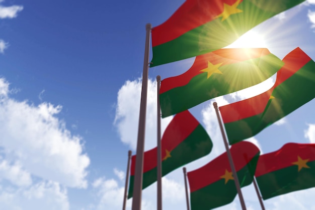 Burkina faso vlaggen zwaaien in de wind tegen een blauwe lucht d rendering