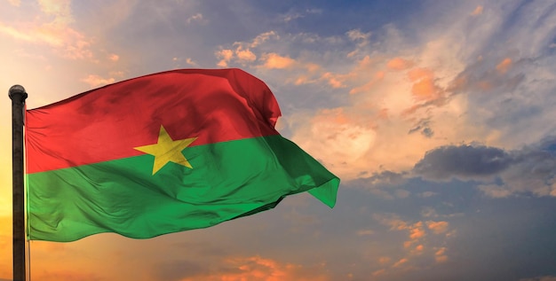 The burkina_faso waving flag and sky background.