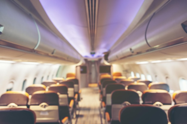 Burl Background of an airplane cabin looking along the aisle