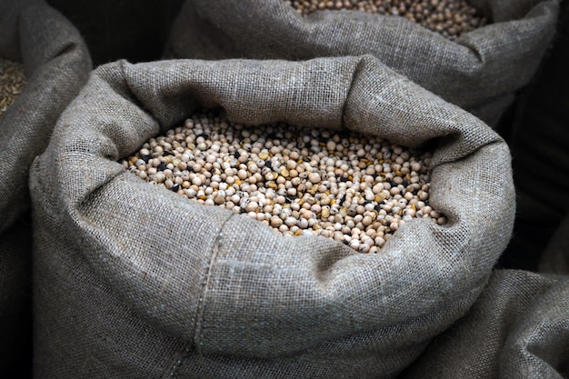 Burlap Sack with grains close up Premium Photo