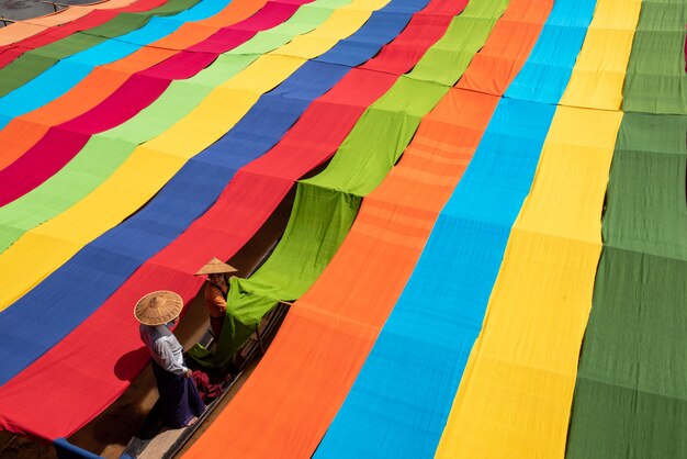 Burmese dry thread the Handmade colorful lotus fabrics at Inle Lake, Shan State in Myanmar.