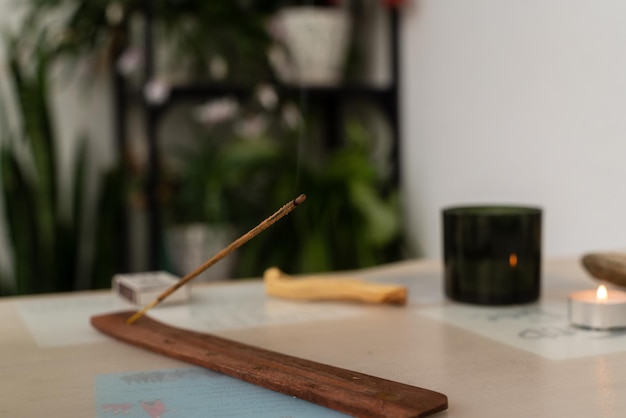 Burning aromatic incense stick for meditation and relaxing aromatherapy smoke selective focus