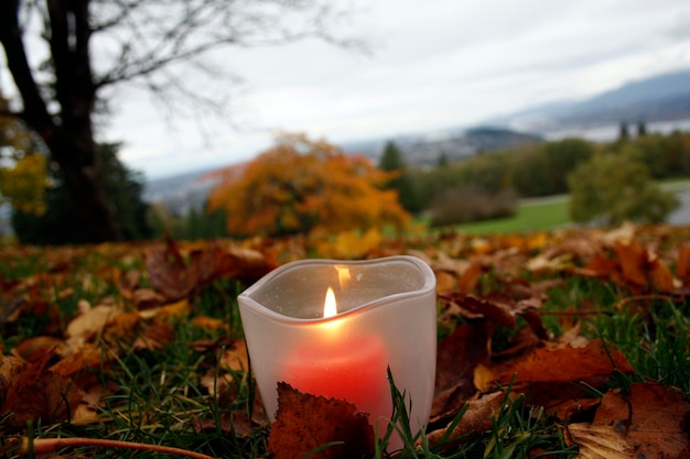 Burning candle in the autumn park in Burnaby British Columbia Canada