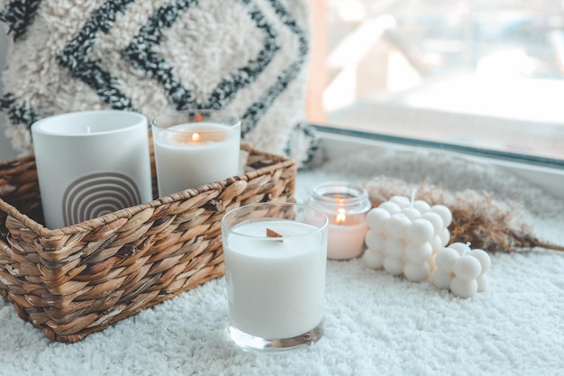 Burning candle in cozy home interior