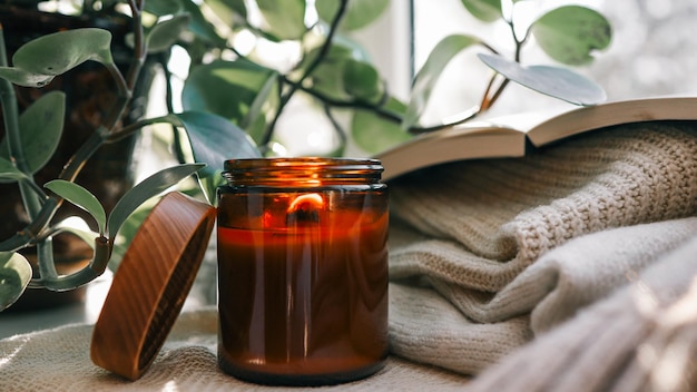 Burning candle in a cozy home interior