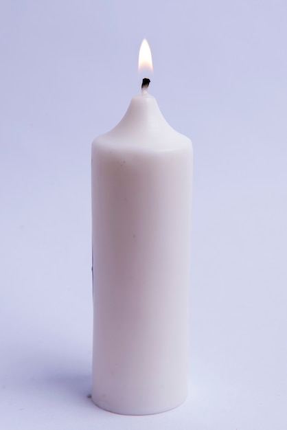 Burning candle with white background