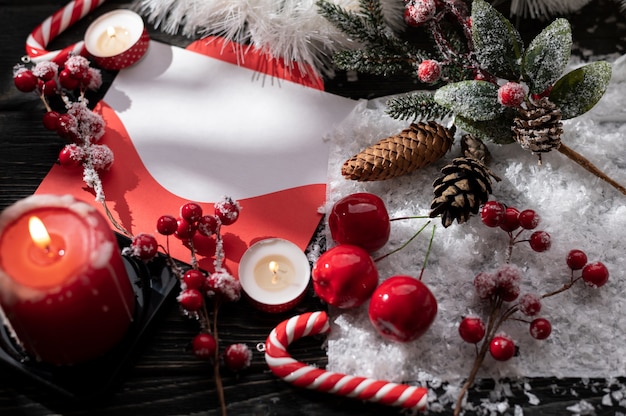 Burning candles and Christmas decoration on wooden table