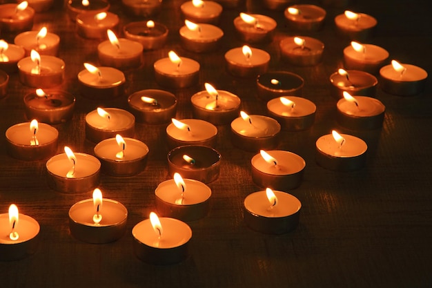 Burning candles on dark background