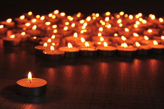 Burning candles on dark background