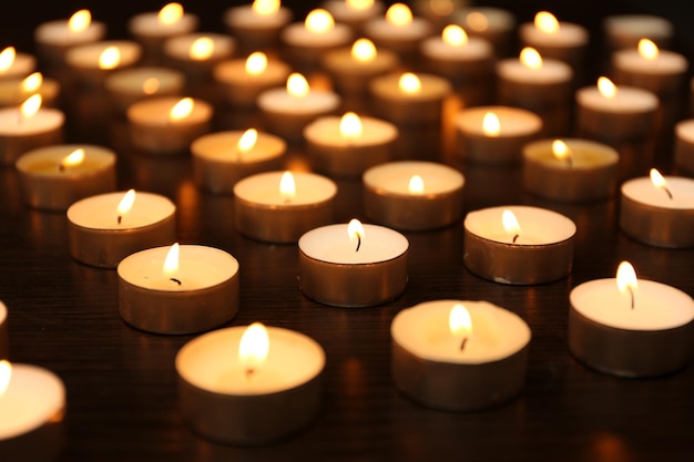 Burning candles on dark background