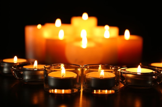 Burning candles on dark background