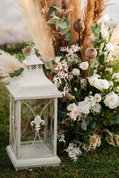 Burning candles on a dark night in a wooden lantern as a decoration for a holiday