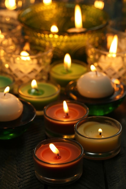 Burning candles in glass candlesticks close-up