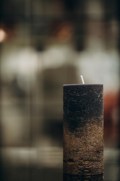 Burning candles on table indoors