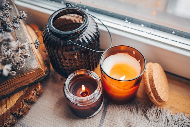 Burning candles on the window autumn atmospheric photo