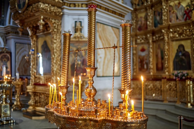 Burning church candles near the altar closeup