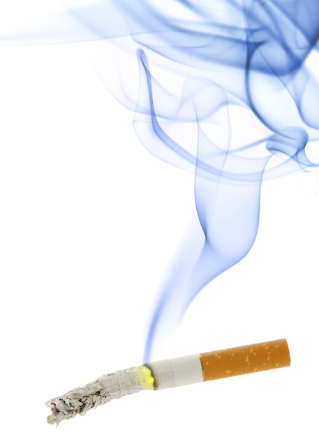 Burning cigarette with smoke isolated over the white background