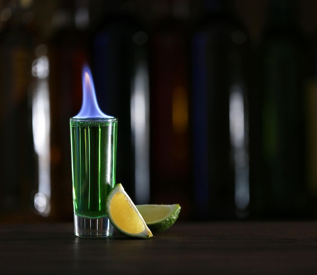 Burning cocktail on table in a bar