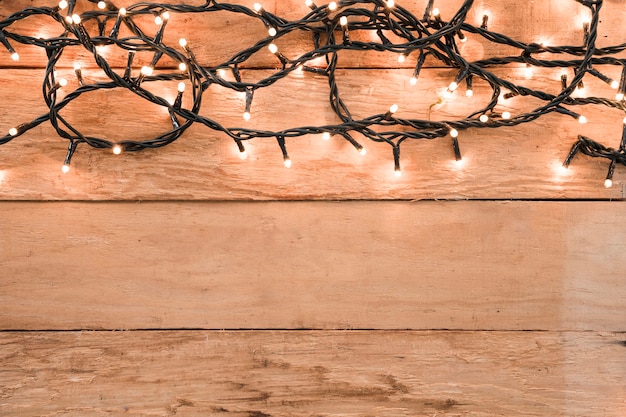 Burning garland on table 