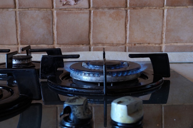 Burning gas on a double-row gas ring on the stove