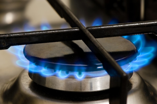 A burning gas stove The use of natural gas at home and in the kitchen