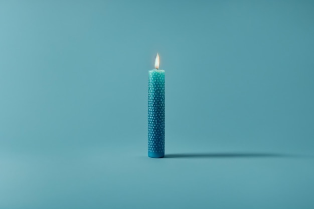 Burning handmade candle with cell pattern